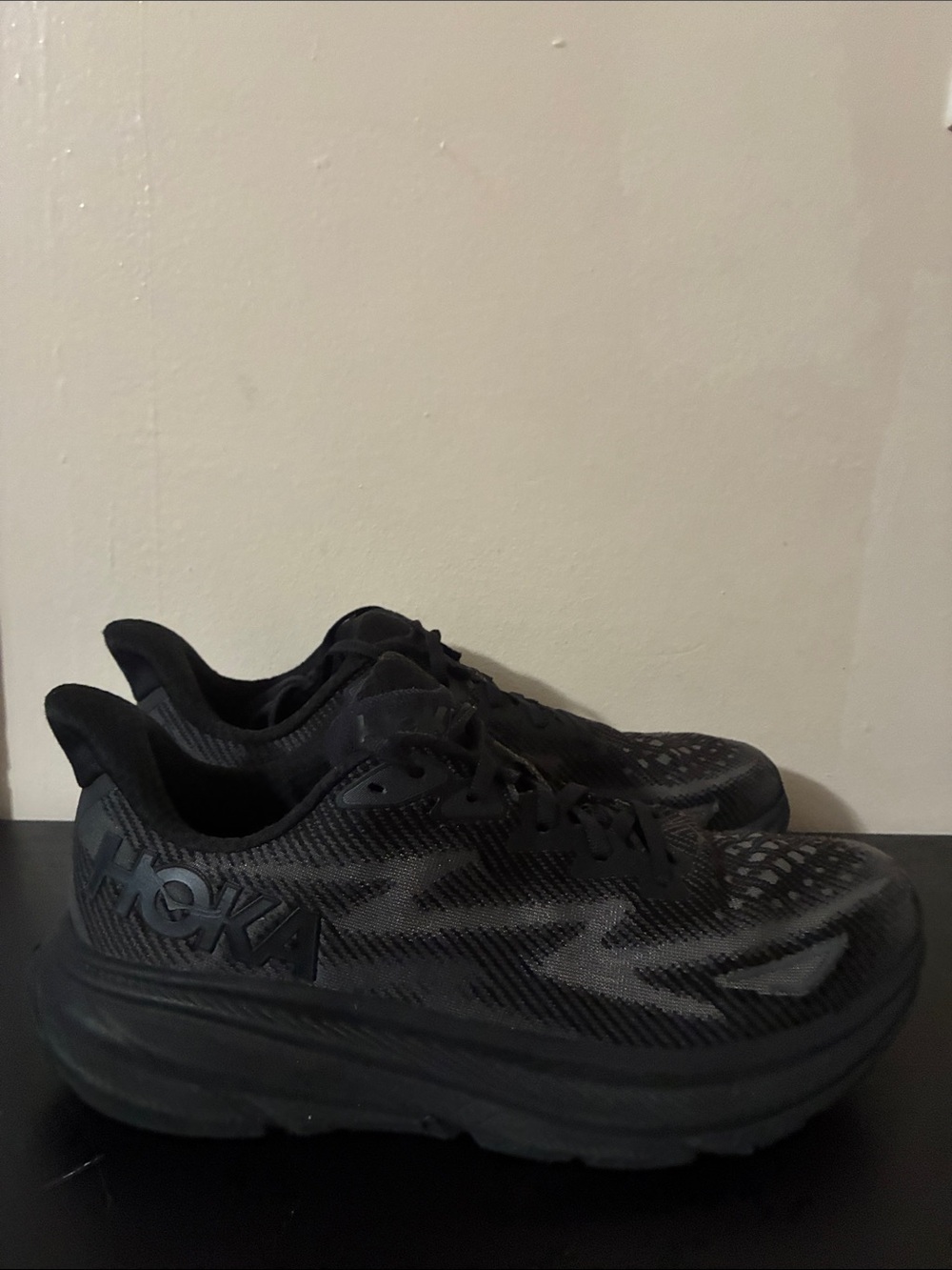 Hoka Clifton 9 Triple Black running shoes, featuring an all-black mesh size 10 M
